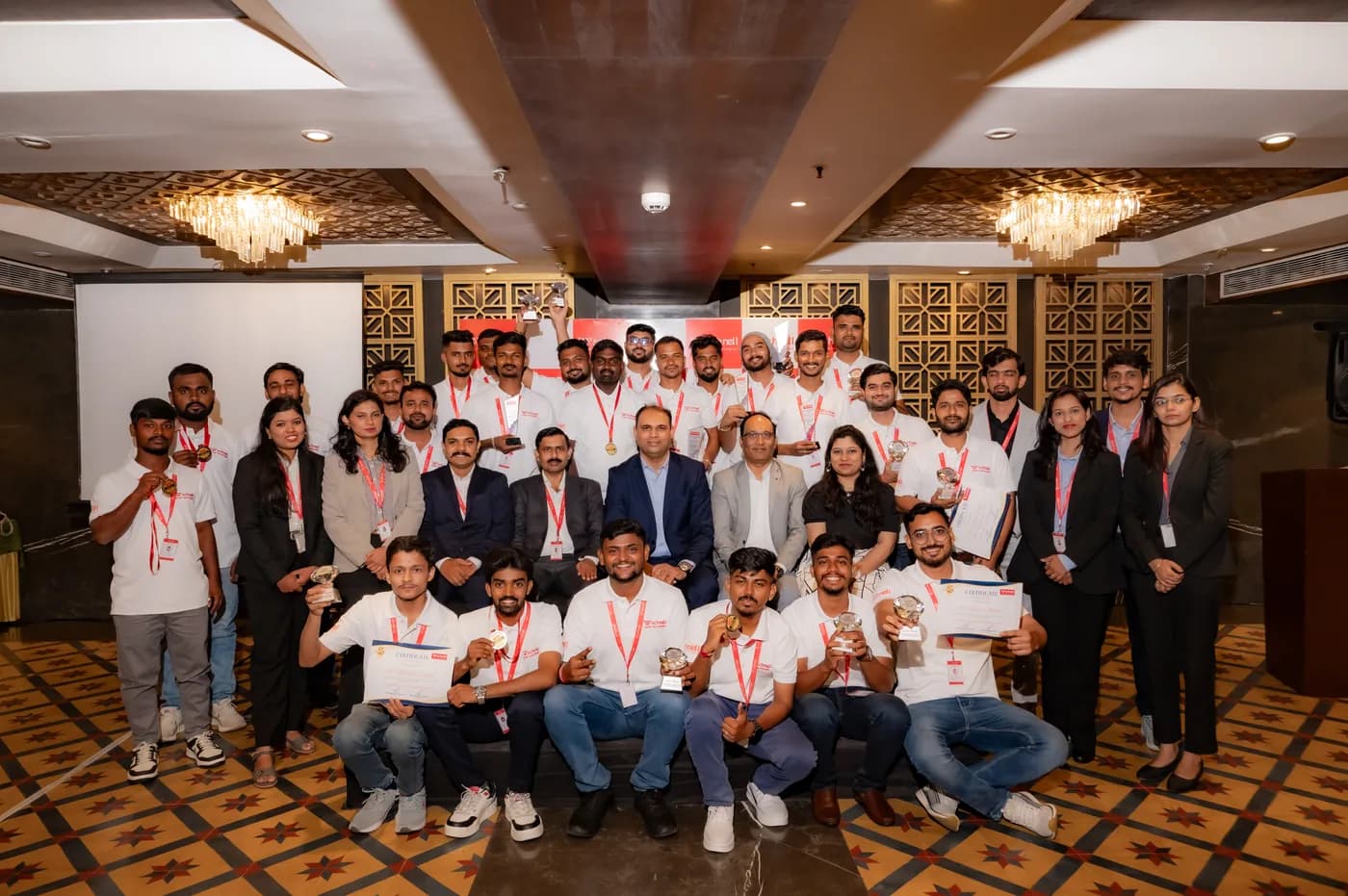 Schnell drone pilots and engineers receiving certificates at a project felicitation ceremony