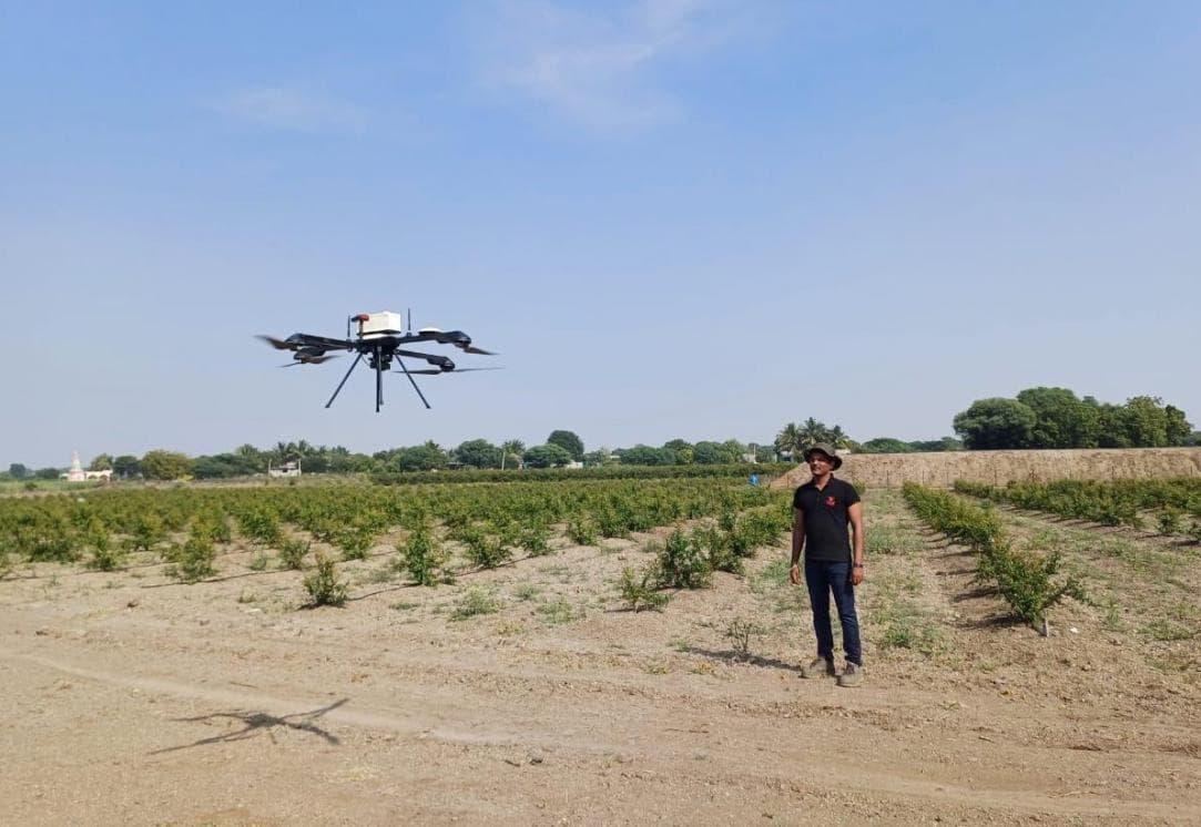 HIMALAYA agricultural spraying drone in flight over a farm field