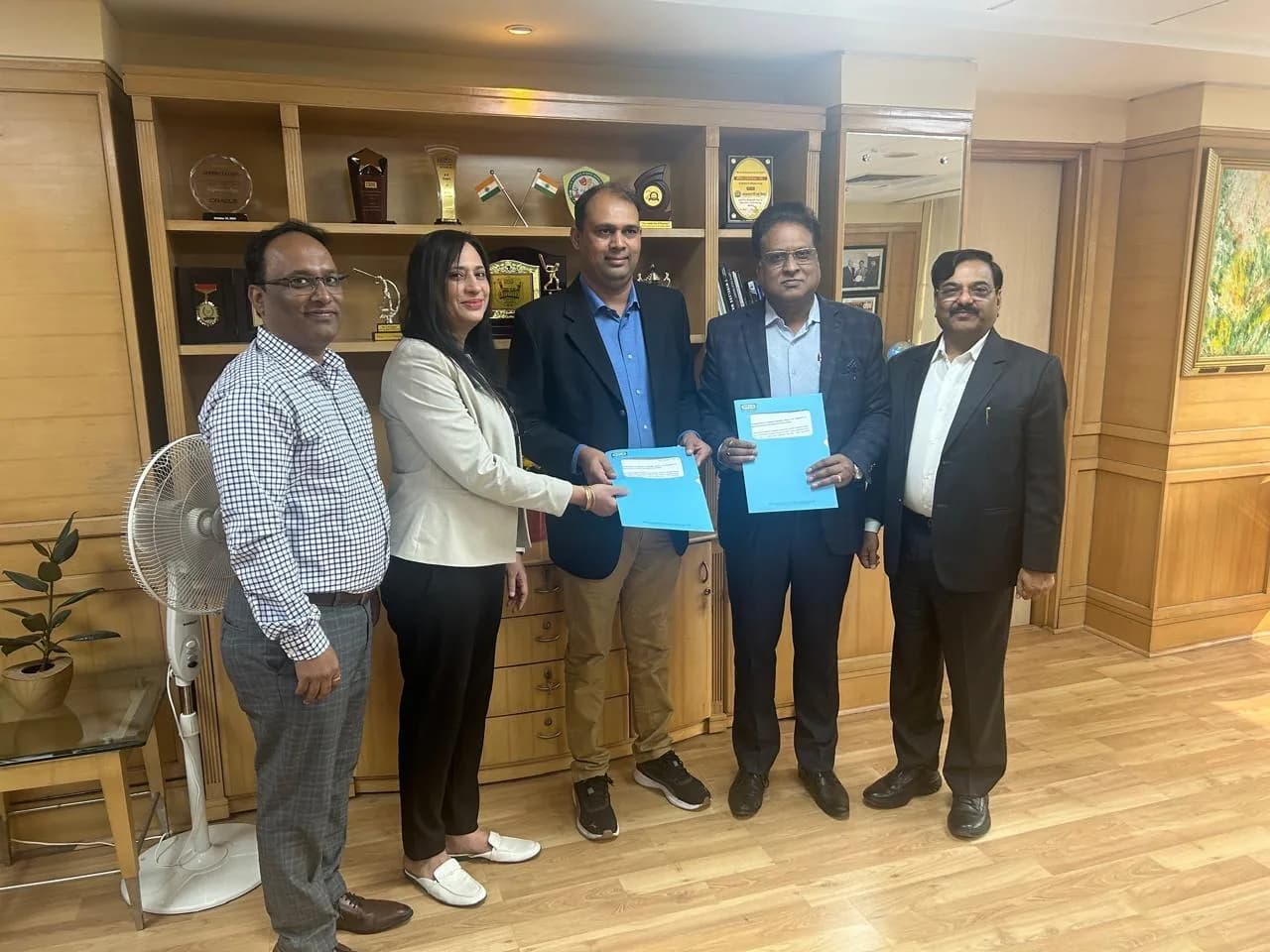 Schnell and IFFCO representatives with the signed Memorandum of Agreement for the Rabi season