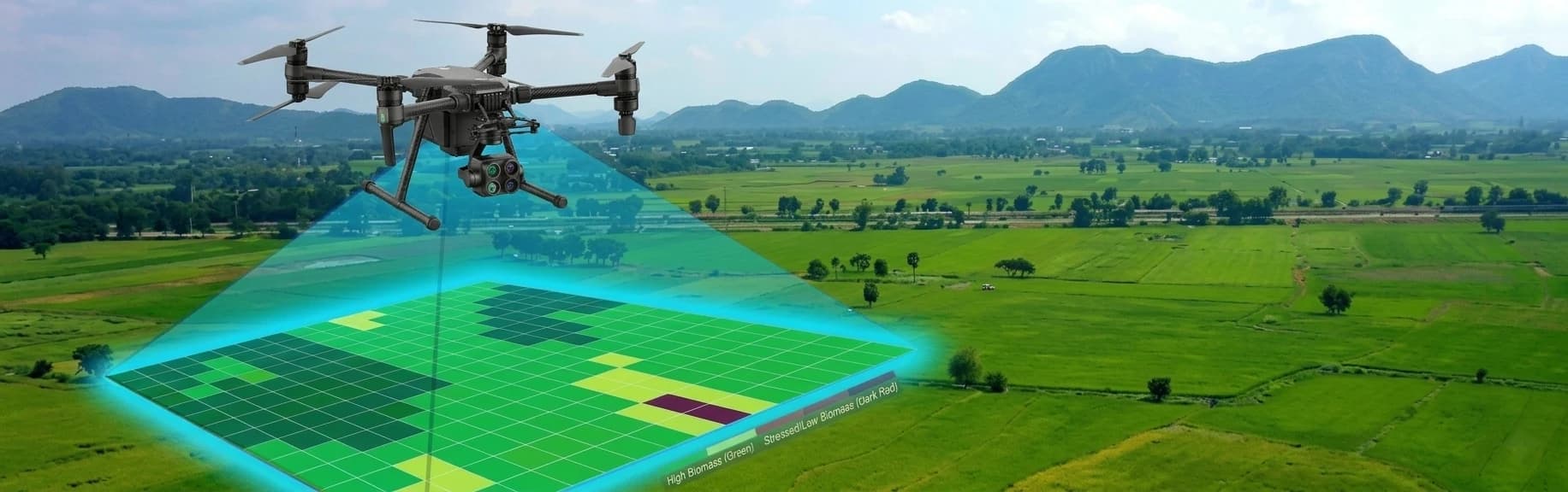 Mapping drone projecting a survey grid over farmland with mountains behind