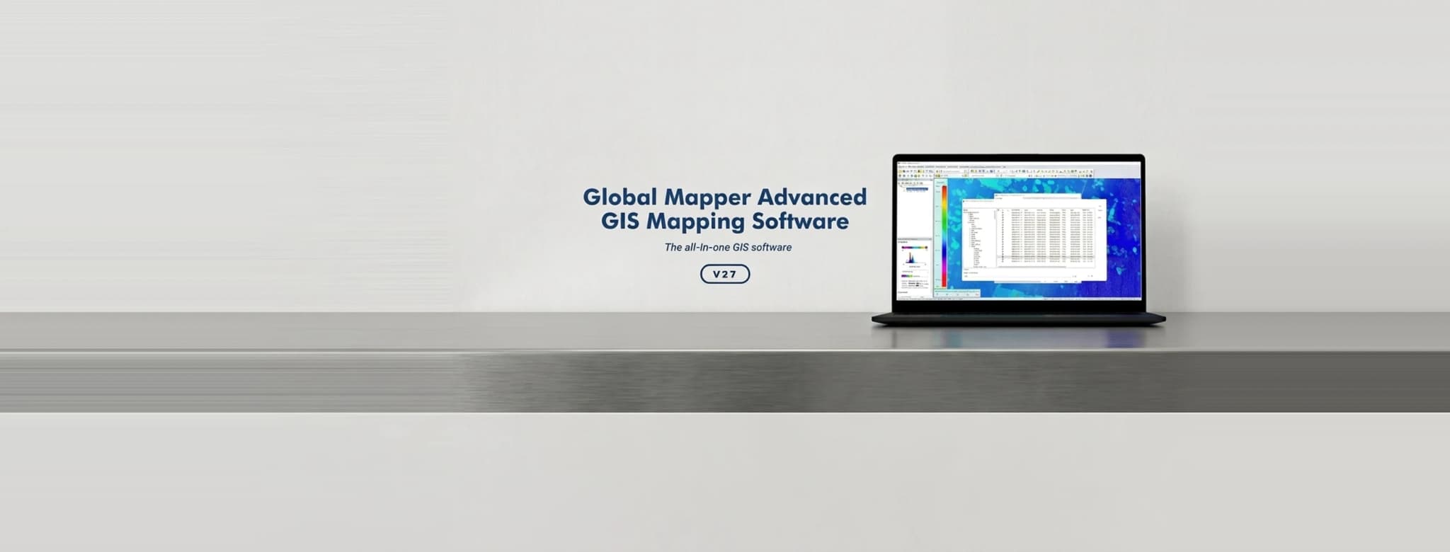 Global Mapper running on a laptop, showing a coloured elevation raster and attribute tables