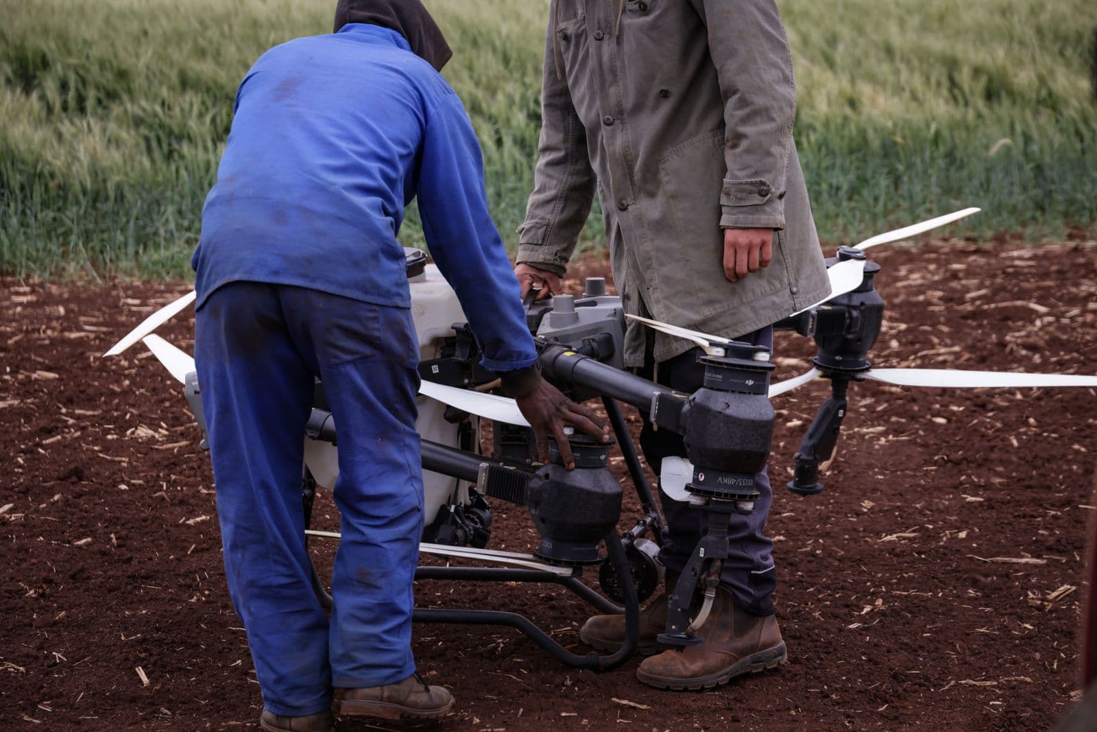 Field team preparing a drone for a mission